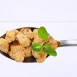 Spoon,Of,Soy,Meat,Cubes,On,White,Wooden,Background